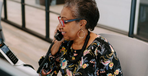 woman on phone talking about advisor solutions